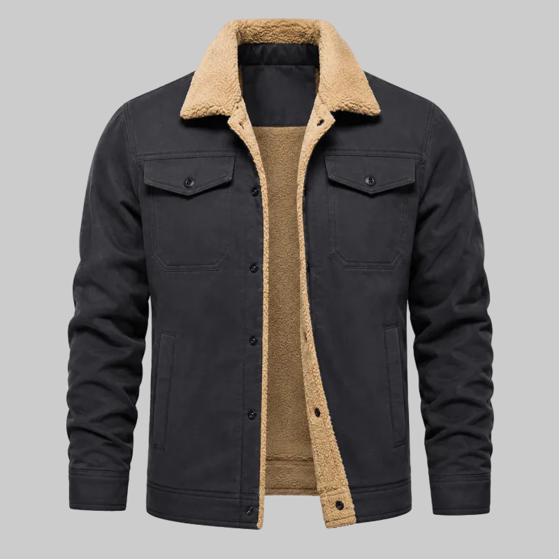 A men's dark charcoal gray jacket with a warm beige sherpa fleece lining on the collar, front placket, and pockets, shown on a clean white background.